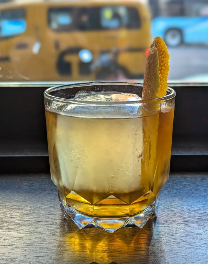 Real phone photo of a cocktail — before